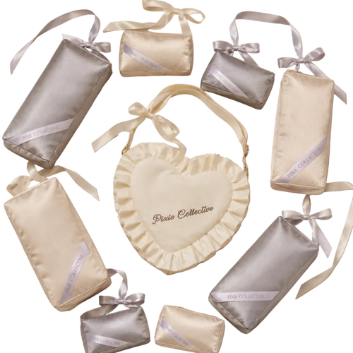 Pixie Collective gift set including a cream heart-shaped bag and matching silver and cream purse pillows in various sizes